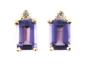 Emerald cut amethyst and diamond earring in yellow gold.