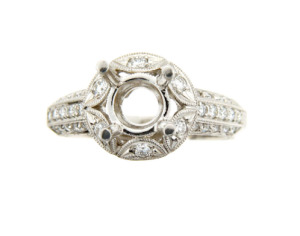 Antique style engagement ring setting with pavé set side stones in platinum.