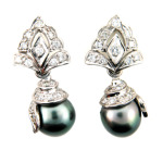 Black pearl and pavé set diamond earrings in white gold.