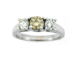 Canary diamond engagement ring with side stones in white gold.