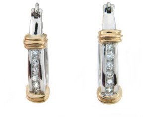 Channel set diamond dangle earrings in white gold.