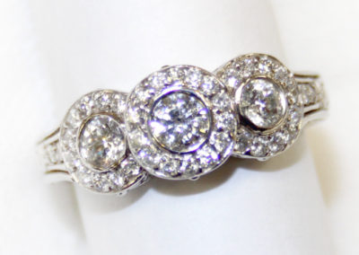 Three diamond ring with halo.