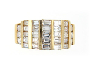 Channel set diamond anniversary band in yellow gold.