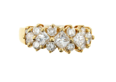 Princess and round cut diamond anniversary band in yellow gold.