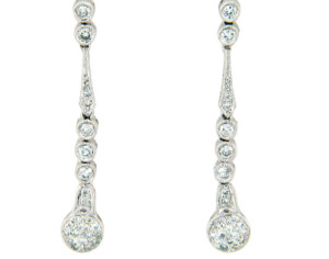 Diamond dangle earrings in white gold.