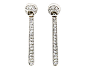 Pavé set diamond dangle earrings in white gold.