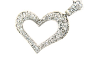 Pavé set diamond heart pendant in white gold.