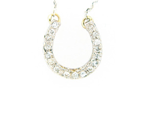 Diamond horseshoe pendant in white gold.