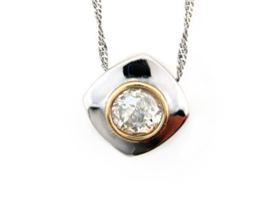 Diamond solitaire pendant in white gold.