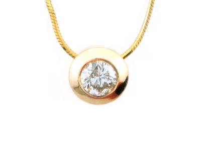 Diamond solitaire pendant in yellow gold.