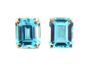 Emerald cut blue topaz earrings in yellow gold.