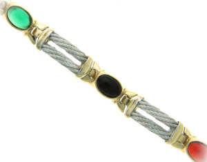 Cabechon emerald, sapphire and ruby bracelet in yellow and white gold.