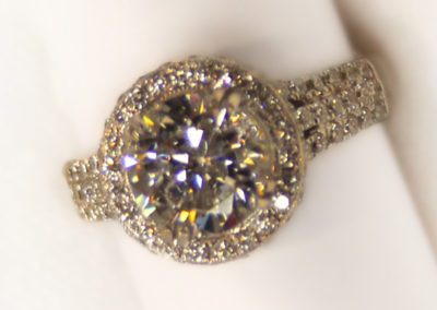 Round halo diamond ring.