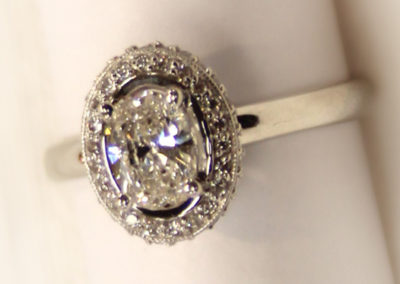 Oval halo diamond ring.