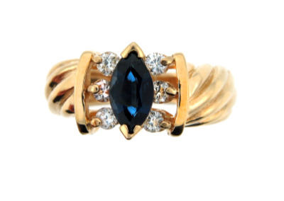 Marquis cut sapphire ring in yellow gold.