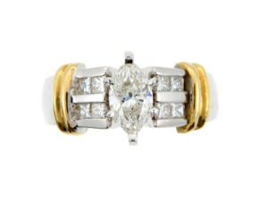 Marquise diamond engagement ring in yellow and white gold.