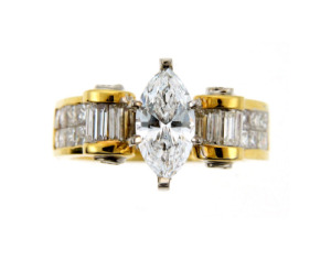 Marquise diamond engagement ring in yellow gold.