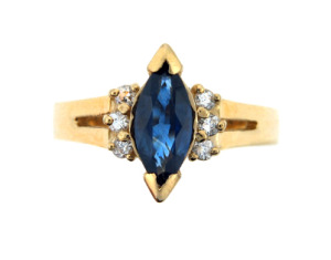 Marquise sapphire and diamond ring in yellow gold.