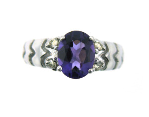 Oval amethyst and diamond ring in white gold.