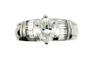 Oval diamond engagement ring in platinum.