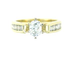 Oval diamond engagement ring in yellow gold.