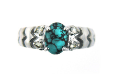 Oval turquoise and diamond ring in white gold.