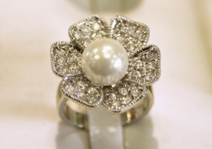 White pearl flower ring.