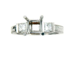 Princess cut engagement ring setting in white gold.