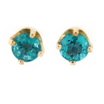 Round blue topaz earrings in yellow gold.