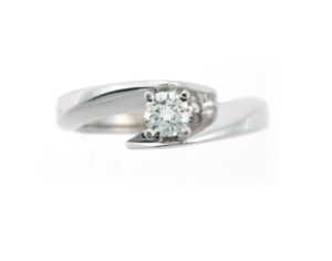 Round brilliant cut contemporary engagement ring in white gold.