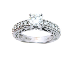 Round brilliant cut diamond engagement ring with pavé set side stones in white gold