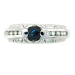 Round sapphire ring with channel set diamonds.