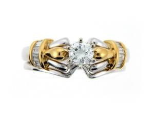 Brilliant cut diamond ring in white and yellow gold.