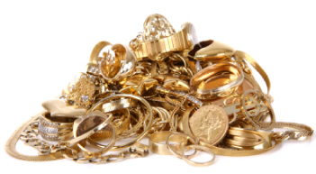 we-buy-gold - pile of old gold jewelry and coins