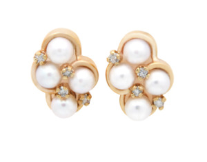 Pearl and diamond cluster earrings in yellow gold.
